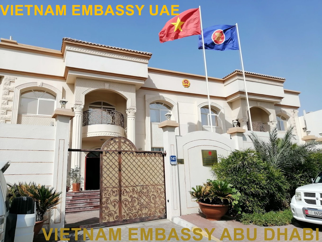 Vietnam Embassy building in Abu Dhabi, UAE, showcasing the national flags and the embassy's elegant architecture