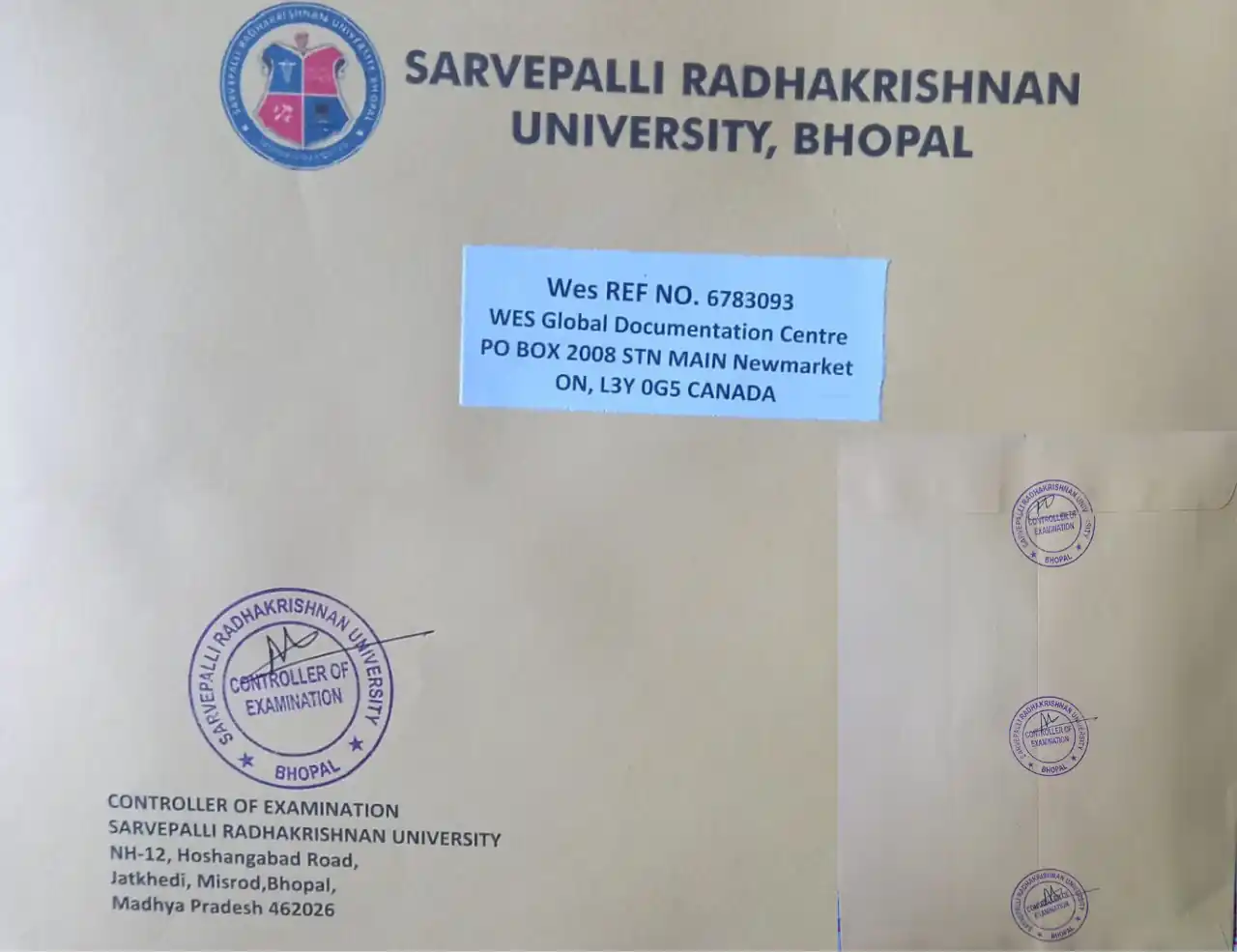 An official sealed envelope from an Indian university, stamped by the Controller of Examination, ready to be sent directly to the WES Global Documentation Centre in Canada for credential evaluation.